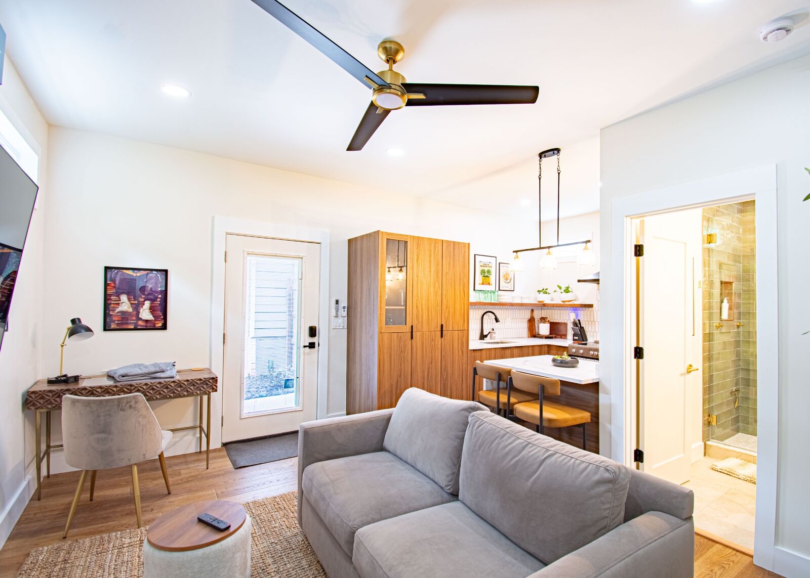 Open-concept ADU interior with living, kitchen, and bathroom view