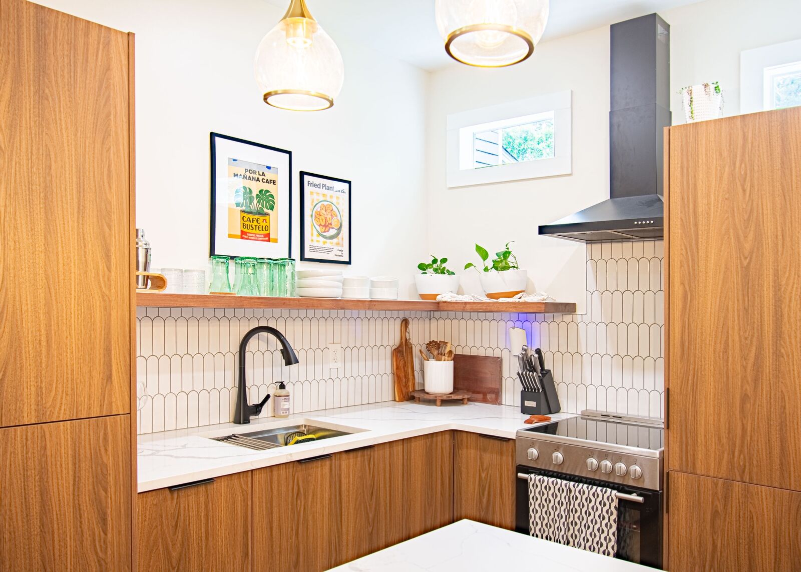 ADU kitchen featuring pendant lighting and stainless appliances
